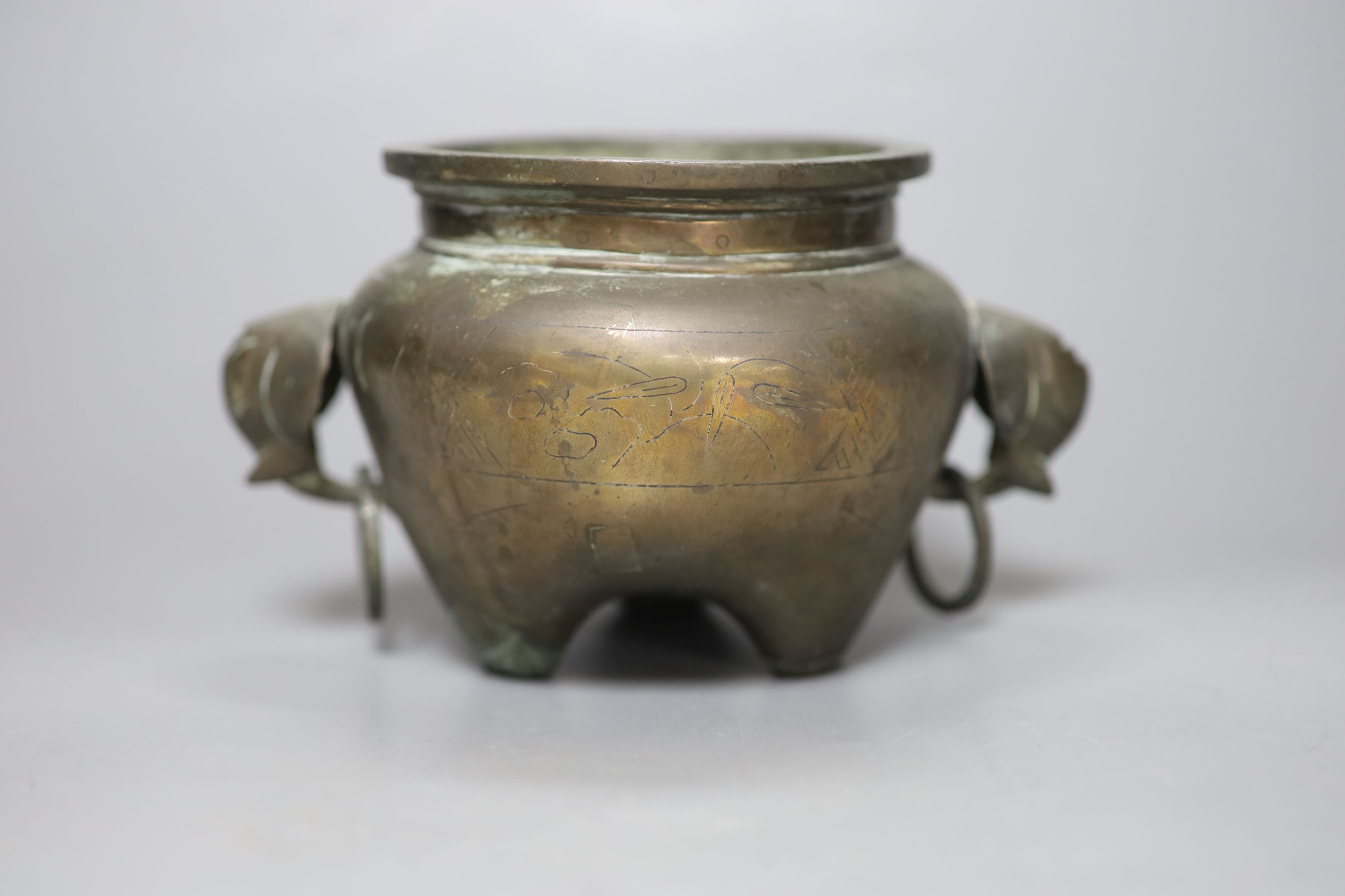 A Chinese bronze and silver inlaid tripod censer, c.1900, a stoneware cover and a crackleglaze inkwell, tallest 10cm